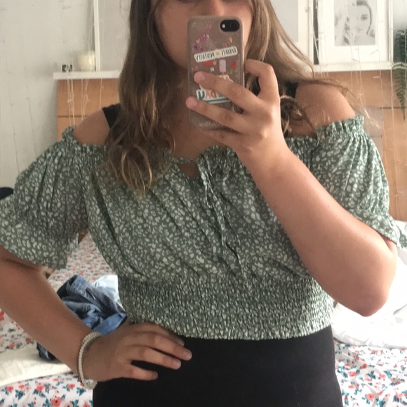 This is a light green crop top with a adjustable strings on top - Picture 2 of 2